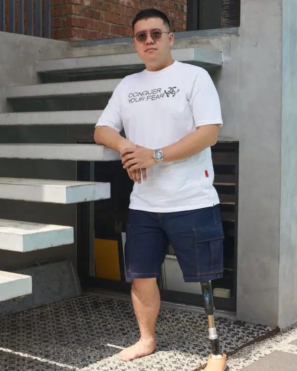 Goh Jun Yang wearing Conquest Conquer Your Fear t shirt in White Colour
